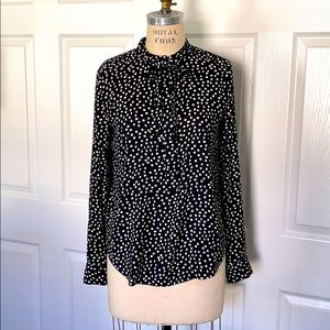 Flowy polka dot blouse with tie.